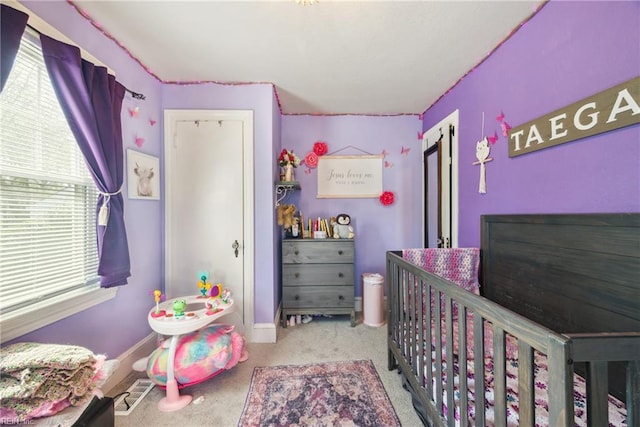 bedroom with carpet flooring and baseboards