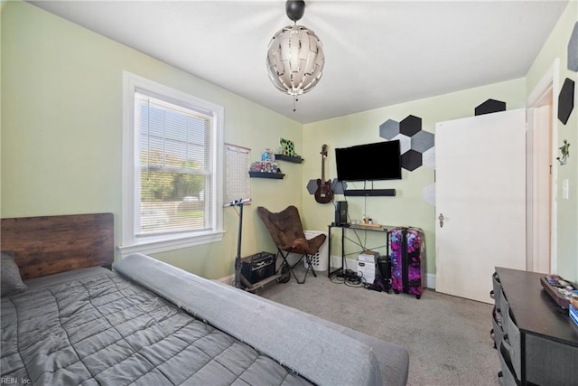 bedroom featuring carpet floors and baseboards
