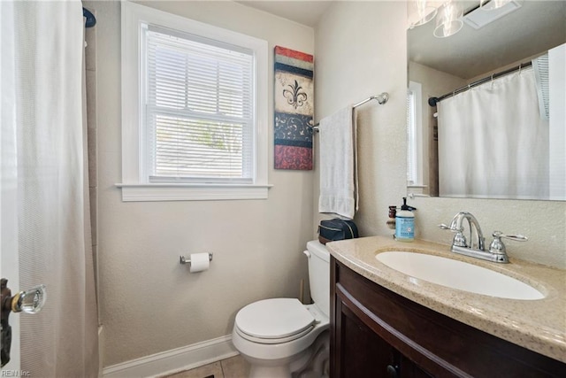 bathroom featuring baseboards, a shower with curtain, toilet, vanity, and tile patterned floors