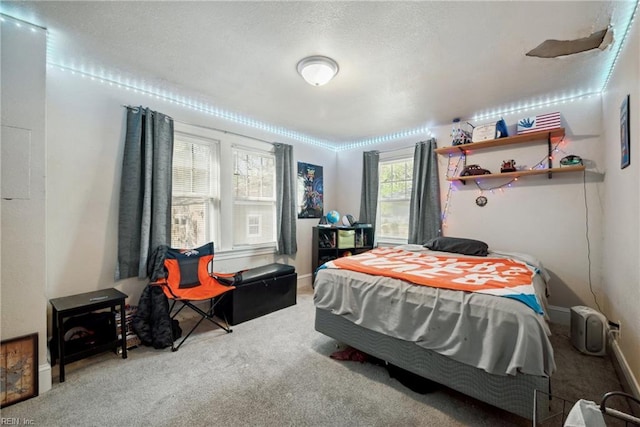 carpeted bedroom with baseboards
