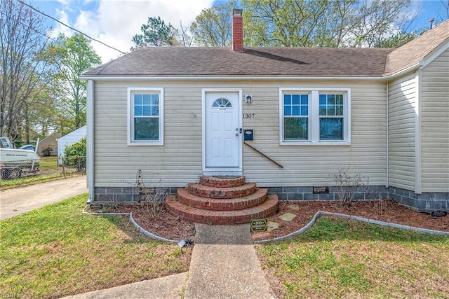 bungalow featuring entry steps, a shingled roof, crawl space, and a chimney