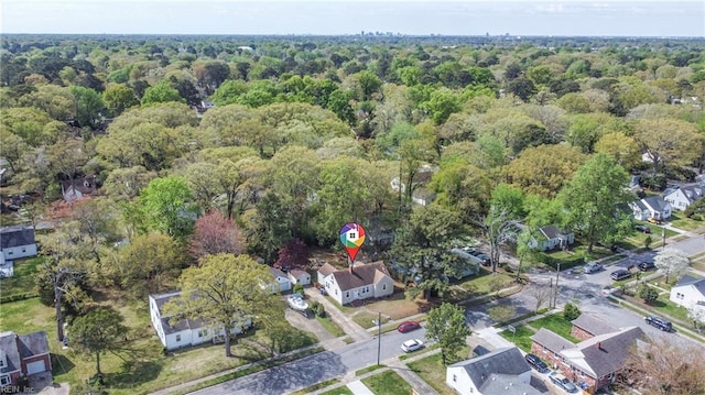 drone / aerial view with a residential view and a forest view