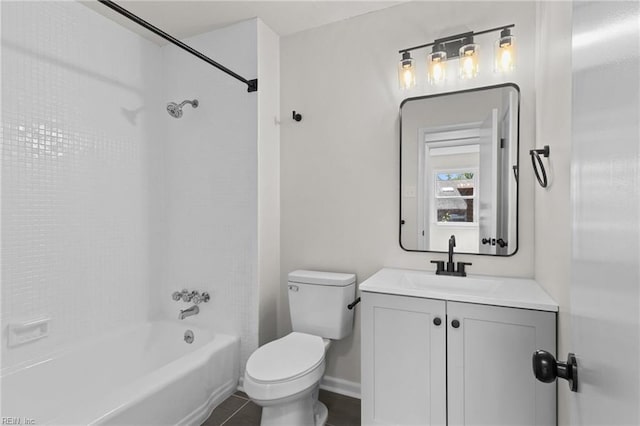 full bathroom featuring vanity, baseboards, tile patterned floors, shower / tub combination, and toilet