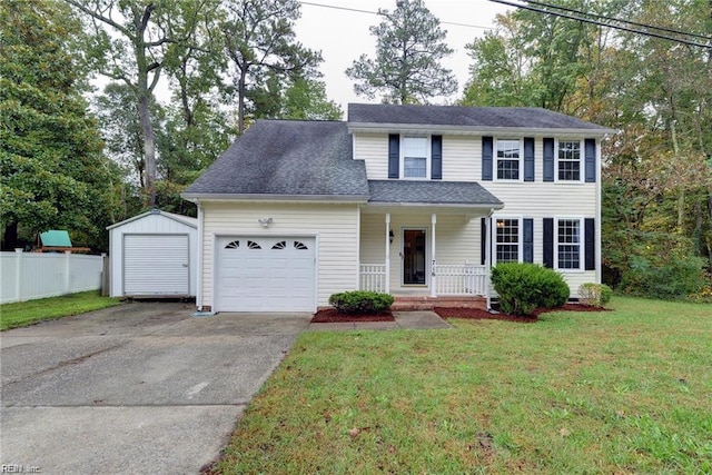 view of front of property featuring a porch, concrete driveway, fence, a garage, and a front yard