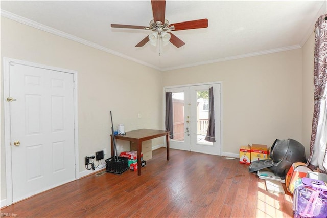 interior space with wood finished floors, ceiling fan, french doors, baseboards, and ornamental molding
