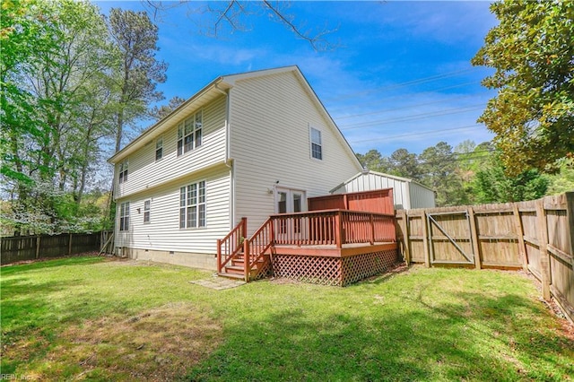back of property featuring a lawn, a fenced backyard, a gate, and a deck