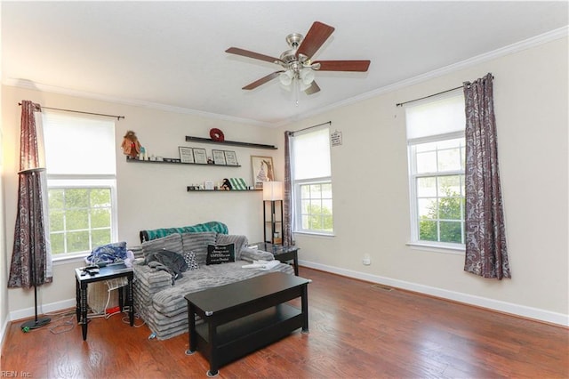 sitting room with ornamental molding, ceiling fan, a healthy amount of sunlight, and wood finished floors