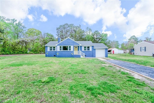 ranch-style house featuring a front yard, a chimney, an attached garage, and gravel driveway
