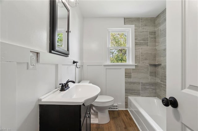 full bathroom with vanity, a wainscoted wall, toilet, and wood finished floors