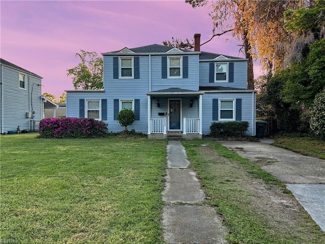 3503 White Chapel Rd, Norfolk, VA 23509 - view of front of house featuring a porch, a chimney, a front lawn, and a shingled roof
