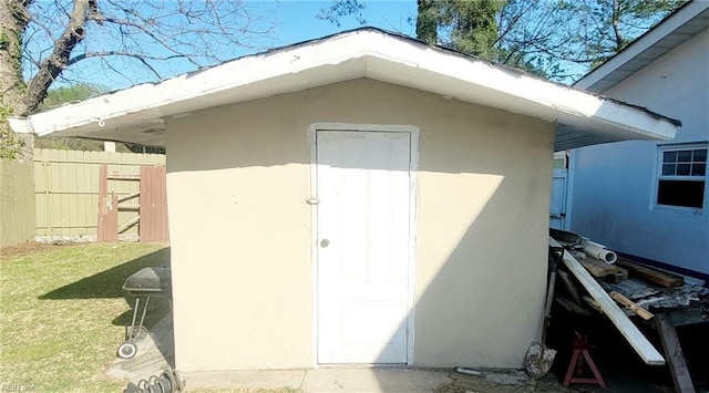 view of shed with fence