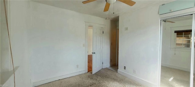 unfurnished bedroom featuring a closet, carpet flooring, baseboards, and a ceiling fan