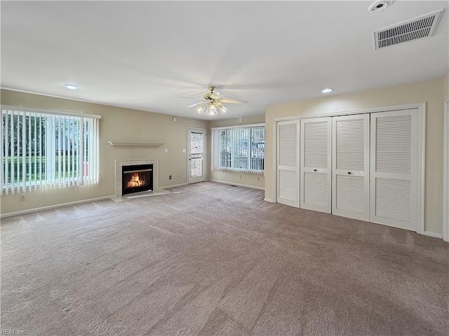 1279 Old Buckroe Rd, Hampton, VA 23663 - unfurnished living room featuring baseboards, carpet flooring, a fireplace with flush hearth, visible vents, and ceiling fan