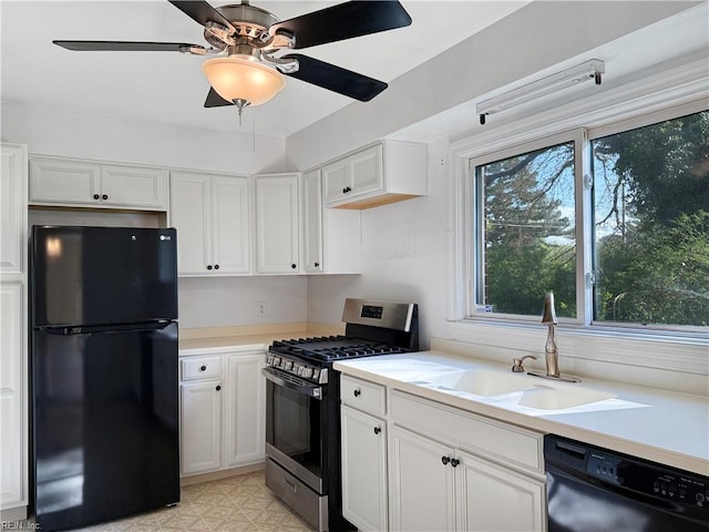 1279 Old Buckroe Rd, Hampton, VA 23663 - kitchen with white cabinets, light countertops, a sink, and black appliances
