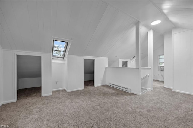 additional living space with carpet floors, vaulted ceiling, and baseboard heating