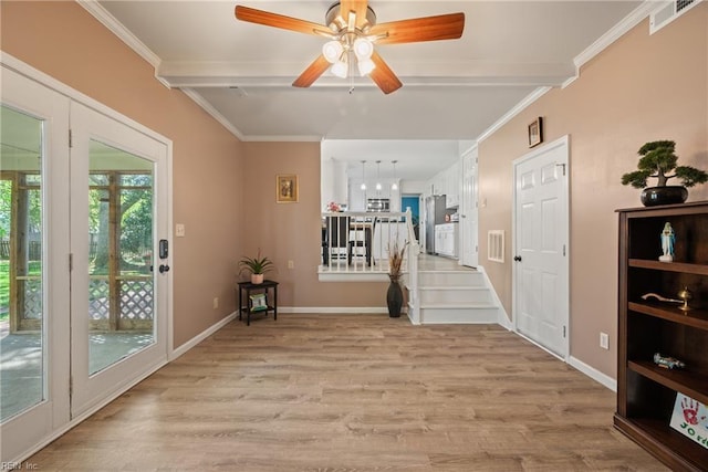943 Tabb Lakes Dr, Yorktown, VA 23693 - entrance foyer featuring light wood finished floors, visible vents, crown molding, and ceiling fan