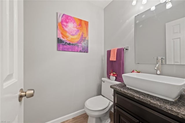 943 Tabb Lakes Dr, Yorktown, VA 23693 - half bath featuring toilet, wood finished floors, vanity, and baseboards