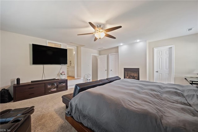943 Tabb Lakes Dr, Yorktown, VA 23693 - carpeted bedroom with visible vents, a ceiling fan, recessed lighting, and a fireplace