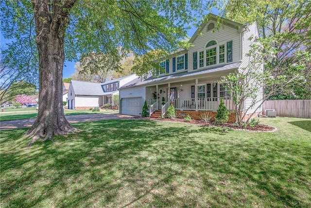 943 Tabb Lakes Dr, Yorktown, VA 23693 - view of front of property with a porch, an attached garage, fence, a front lawn, and driveway