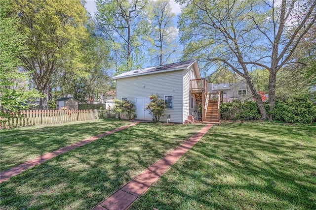 943 Tabb Lakes Dr, Yorktown, VA 23693 - view of yard with stairway, a wooden deck, and fence