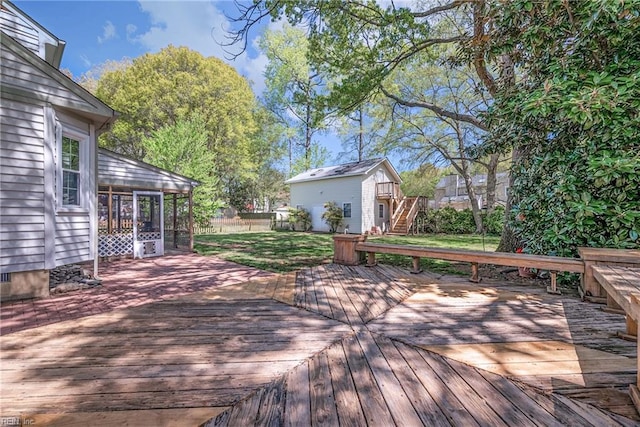 943 Tabb Lakes Dr, Yorktown, VA 23693 - wooden deck featuring a sunroom, fence, stairway, and a lawn