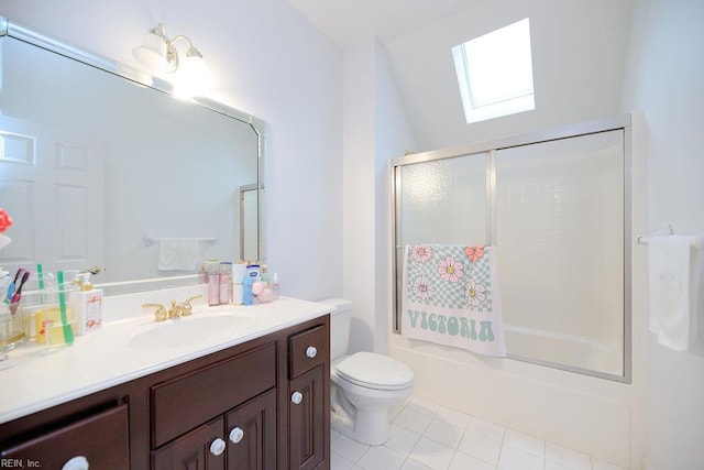 full bathroom featuring vanity, tile patterned flooring, toilet, a skylight, and shower / bath combination