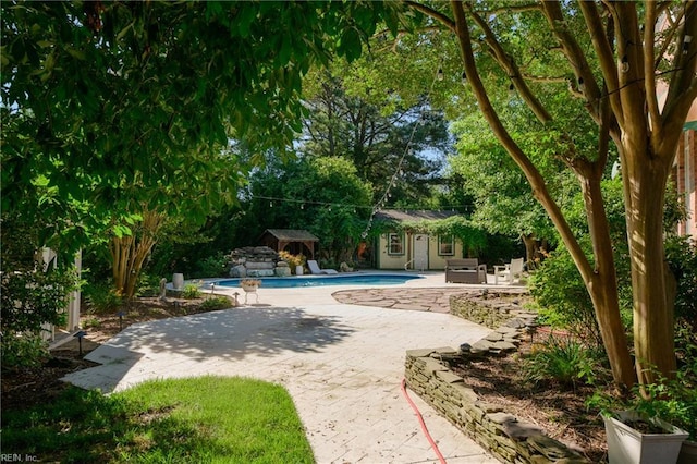 315 Wormley Creek Dr, Yorktown, VA 23692 - outdoor pool with an outdoor structure, a patio area, and an exterior structure