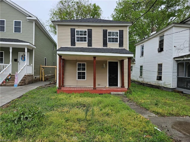 view of front of home with a front yard, a porch, and roof with shingles