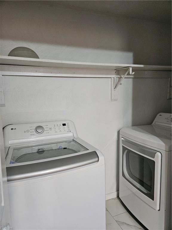 laundry room with washer and dryer and laundry area