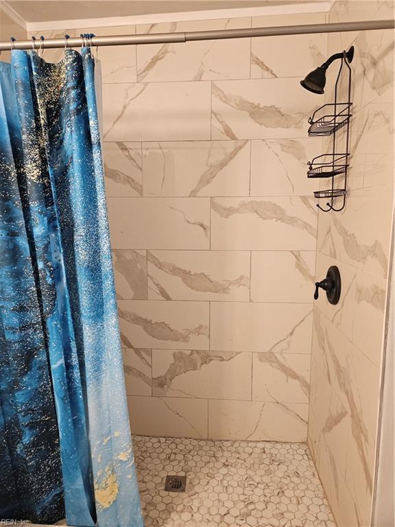 full bathroom with a stall shower