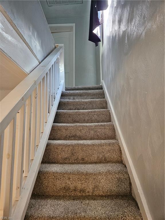 stairway with carpet floors