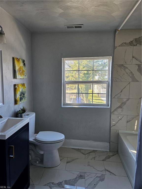 full bathroom featuring visible vents, toilet, marble finish floor, and vanity