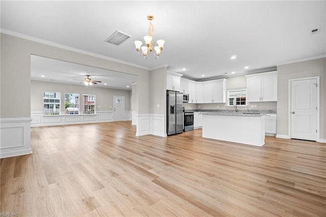 kitchen featuring open floor plan, white cabinetry, light countertops, visible vents, and appliances with stainless steel finishes