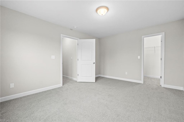 empty room with carpet flooring and baseboards