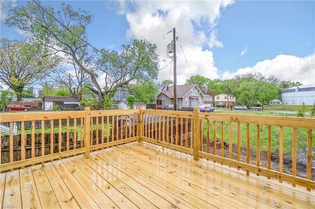 wooden deck with a residential view