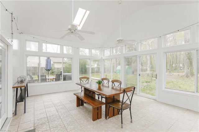 sunroom with high vaulted ceiling and a skylight