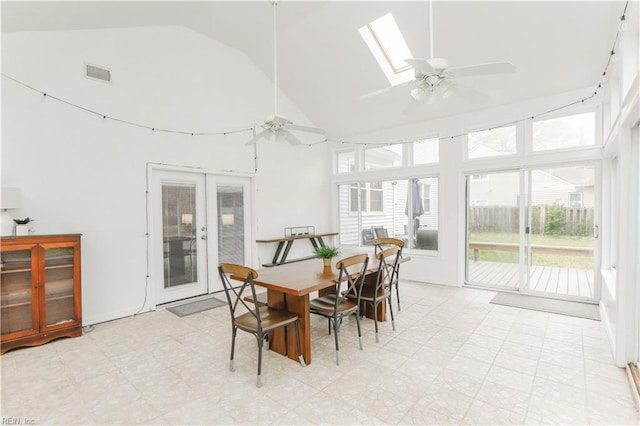 dining room with visible vents, ceiling fan, high vaulted ceiling, and light floors