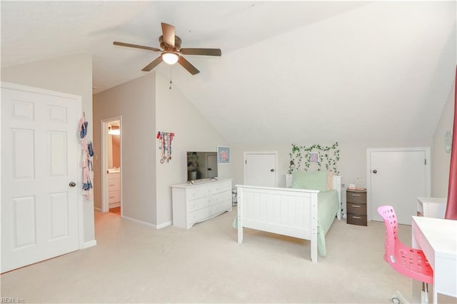 bedroom with baseboards, ceiling fan, light carpet, and lofted ceiling