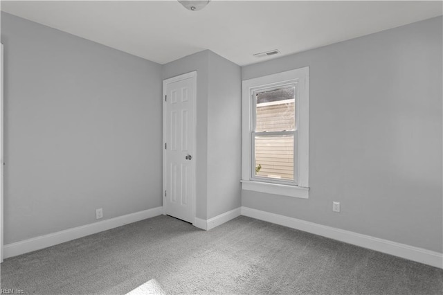 unfurnished bedroom with visible vents, baseboards, and carpet