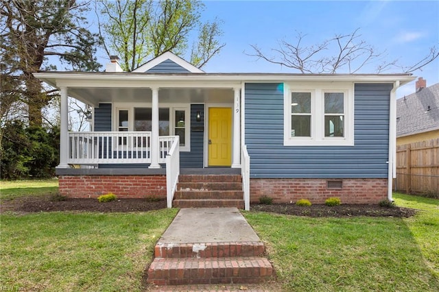 139 Ash Ave, Newport News, VA 23607 - bungalow-style house with a front yard, crawl space, fence, and covered porch