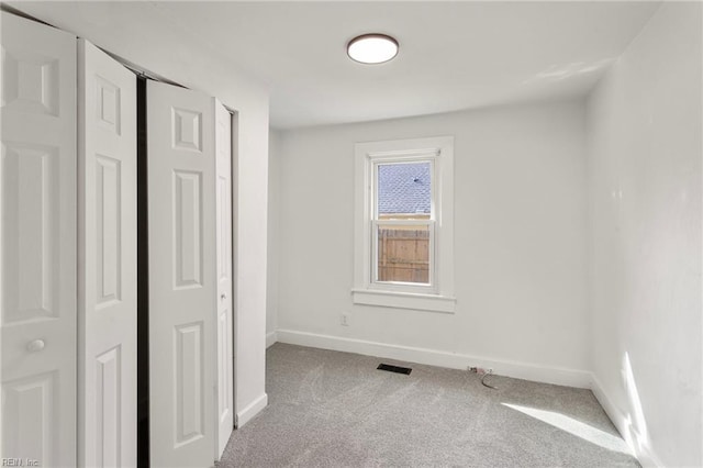 139 Ash Ave, Newport News, VA 23607 - unfurnished bedroom featuring a closet, visible vents, baseboards, and carpet