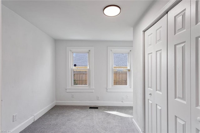 139 Ash Ave, Newport News, VA 23607 - unfurnished bedroom featuring a closet, baseboards, visible vents, and carpet floors