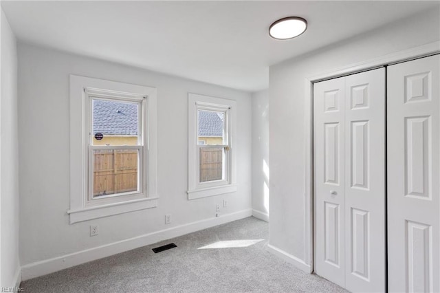 139 Ash Ave, Newport News, VA 23607 - unfurnished bedroom with a closet, carpet flooring, visible vents, and baseboards