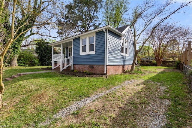 139 Ash Ave, Newport News, VA 23607 - bungalow with a front yard, fence, covered porch, and crawl space