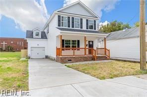 731 33rd St, Newport News, VA 23607 - traditional-style house featuring a porch, a garage, a front yard, and driveway