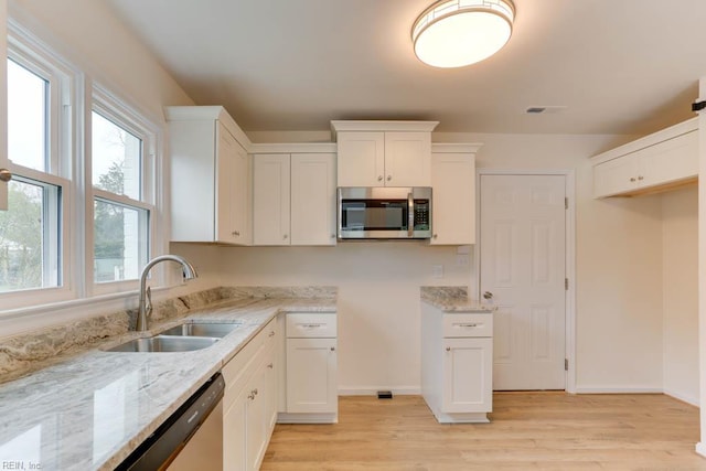 1793 Old Buckroe Rd, Hampton, VA 23664 - kitchen featuring a sink, light stone countertops, light wood-style flooring, and stainless steel appliances