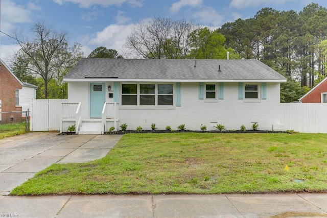 1793 Old Buckroe Rd, Hampton, VA 23664 - single story home with a shingled roof, fence, and a front lawn