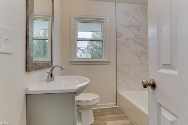 1793 Old Buckroe Rd, Hampton, VA 23664 - full bathroom with toilet, vanity, baseboards, and a healthy amount of sunlight