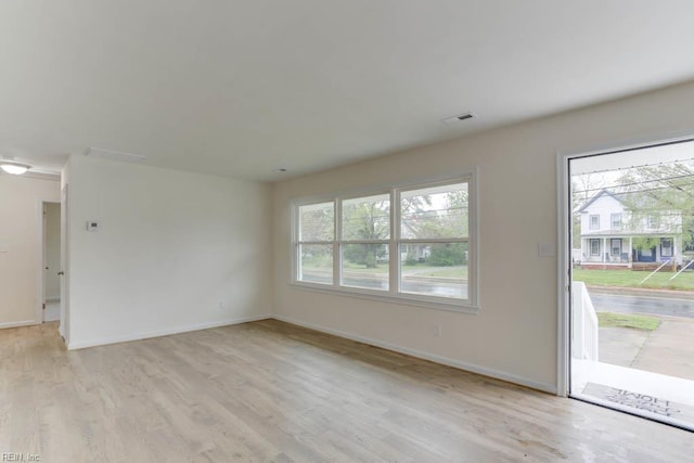 1793 Old Buckroe Rd, Hampton, VA 23664 - unfurnished living room featuring light wood-style floors, baseboards, and visible vents