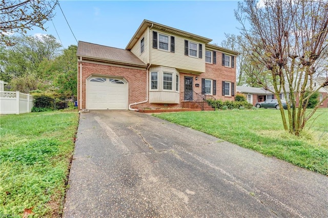 view of front of property featuring a garage, fence, a front lawn, brick siding, and driveway